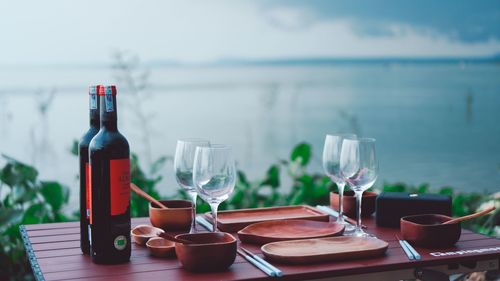 Glass of bottles on table