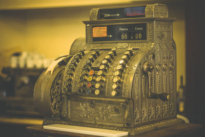 Close up vintage cash register in store sepia effect concept photo