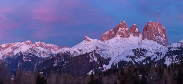 Scenic view of snowcapped mountains against sky during winter