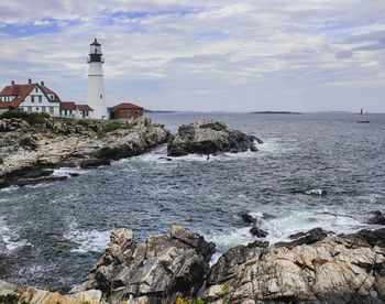 Scenic view of sea against cloudy sky