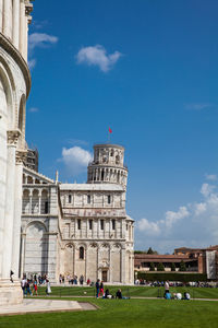 Group of people in front of historical building