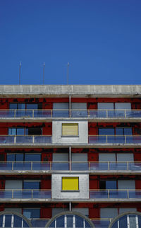 Low angle view of building against clear blue sky