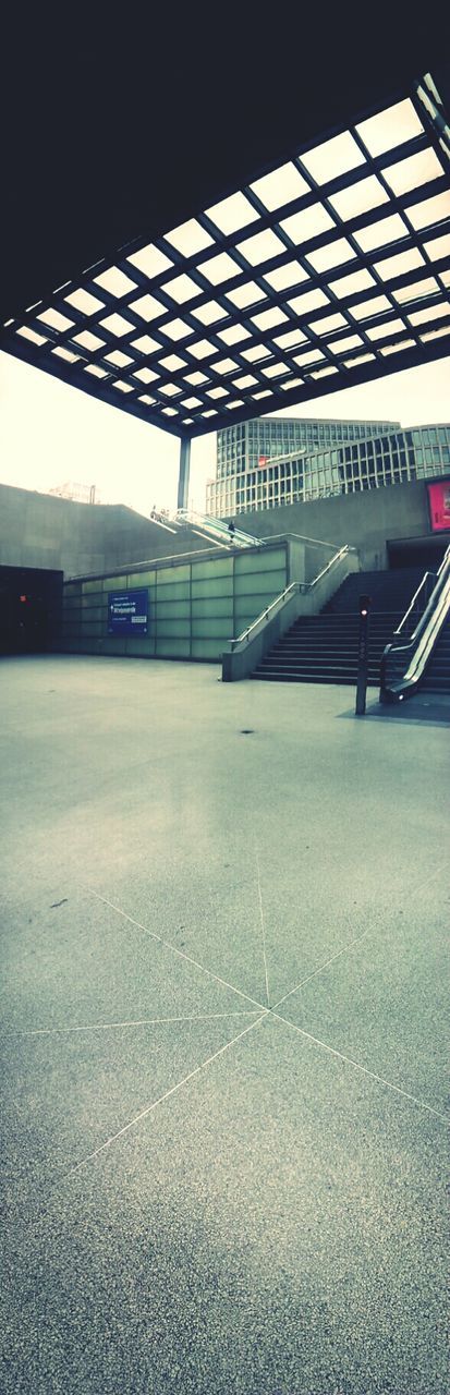 transportation, empty, railroad station platform, indoors, mode of transport, railroad station, architecture, public transportation, built structure, the way forward, road marking, road, illuminated, absence, parking lot, rail transportation, travel, no people, diminishing perspective, land vehicle