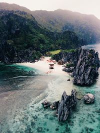 Scenic view of sea and rocks against sky