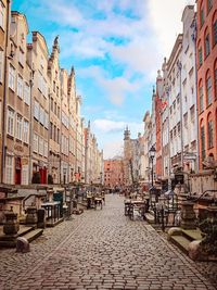 View of street amidst buildings in city