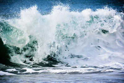 Waves splashing on shore