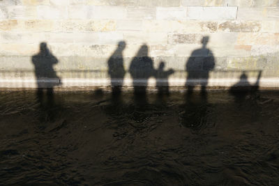 Shadow of people on water