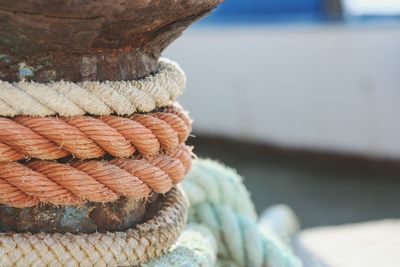 Close-up of ropes tied on bollard