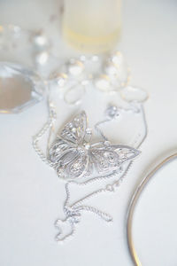 Close-up of jewelry against white background