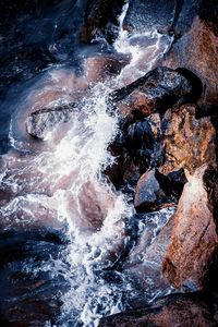 Close-up of water flowing through rocks