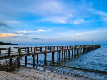 Pier over sea against sky