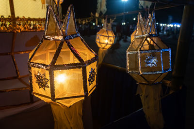 Close-up of illuminated lanterns at night