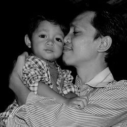 Portrait of mother and son at home