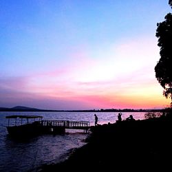 Silhouette of pier at sunset