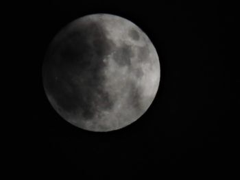 Low angle view of moon against sky at night