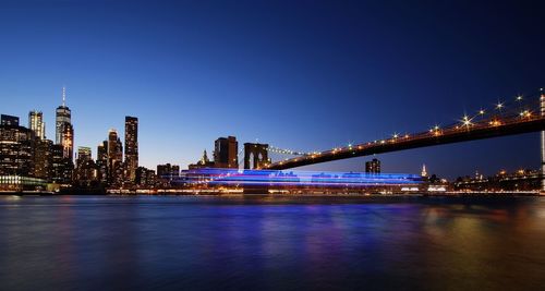 Illuminated city at waterfront