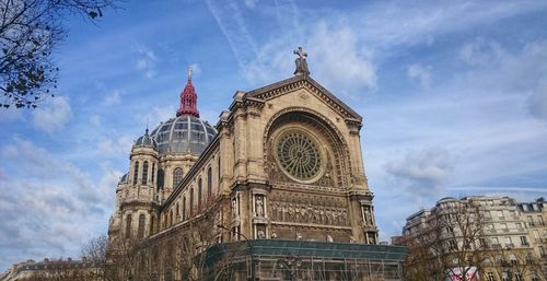 Low angle view of cathedral against cloudy sky