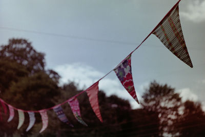 Low angle view of flag against sky