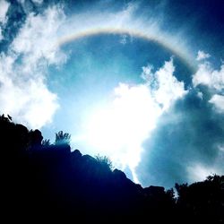 Low angle view of silhouette mountain against sky