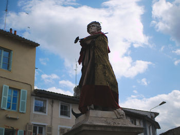 Low angle view of statue against sky