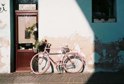 Bicycles on street against building