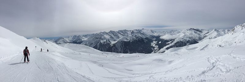 Scenic view of snow covered mountain against sky