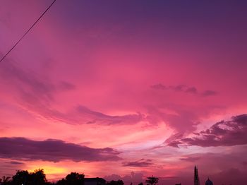 Low angle view of dramatic sky during sunset