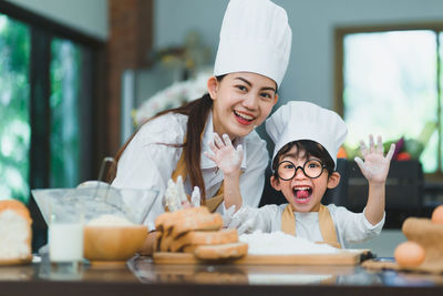 Portrait of a smiling young woman in restaurant