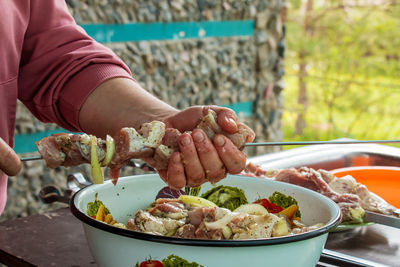 Midsection of man preparing food