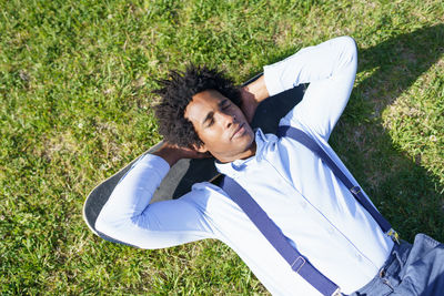 High angle portrait of man lying down on land