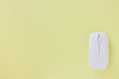 Close-up of electric lamp against wall