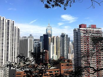 Modern buildings in city against sky