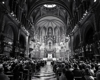 People at illuminated cathedral