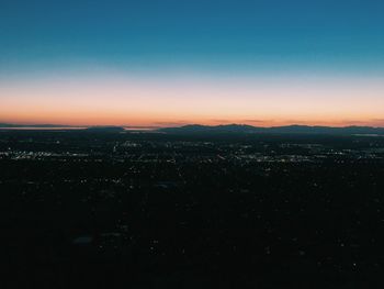Aerial view of illuminated cityscape
