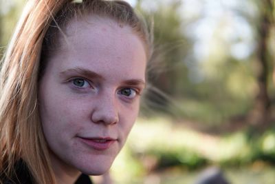 Close-up portrait of a smiling young woman