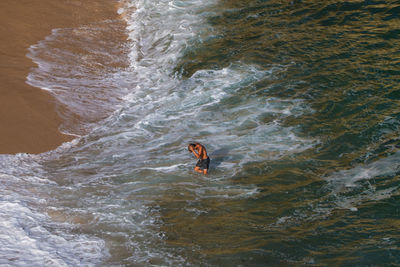 High angle view of people in sea