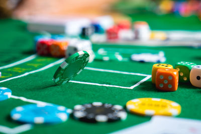 Close-up of colorful gambling chips on table