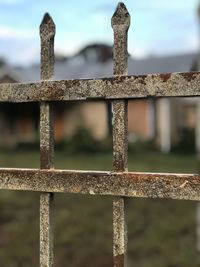 Close-up of rusty metal against sky