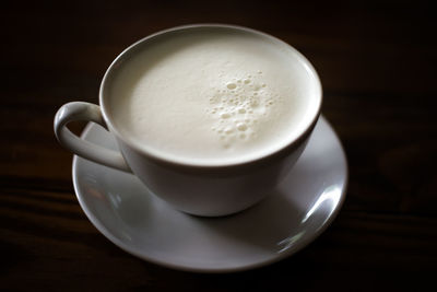 High angle view of coffee cup on table