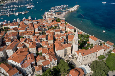 High angle view of townscape by sea