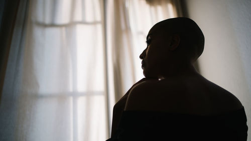 Portrait of man looking away at home
