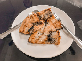 High angle view of fish in plate on table