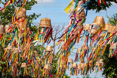 Low angle view of decoration hanging against sky