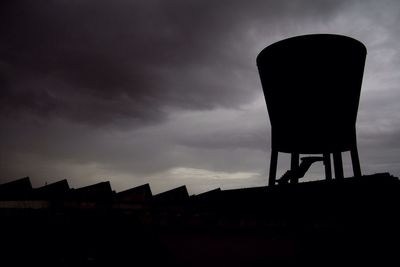 Low angle view of built structure against cloudy sky