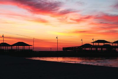 Scenic view of beach against sky during sunset