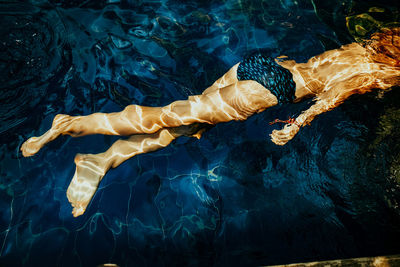 High angle view of swimming in sea