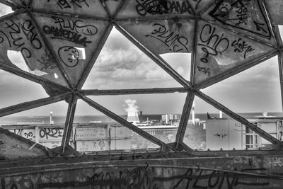 Low angle view of bridge against sky in city