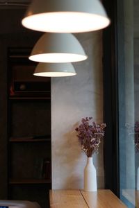 Close-up of illuminated lamp on table