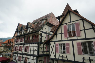 Buildings in city against sky