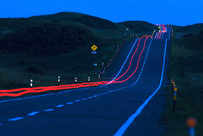 Light trails on road at dusk